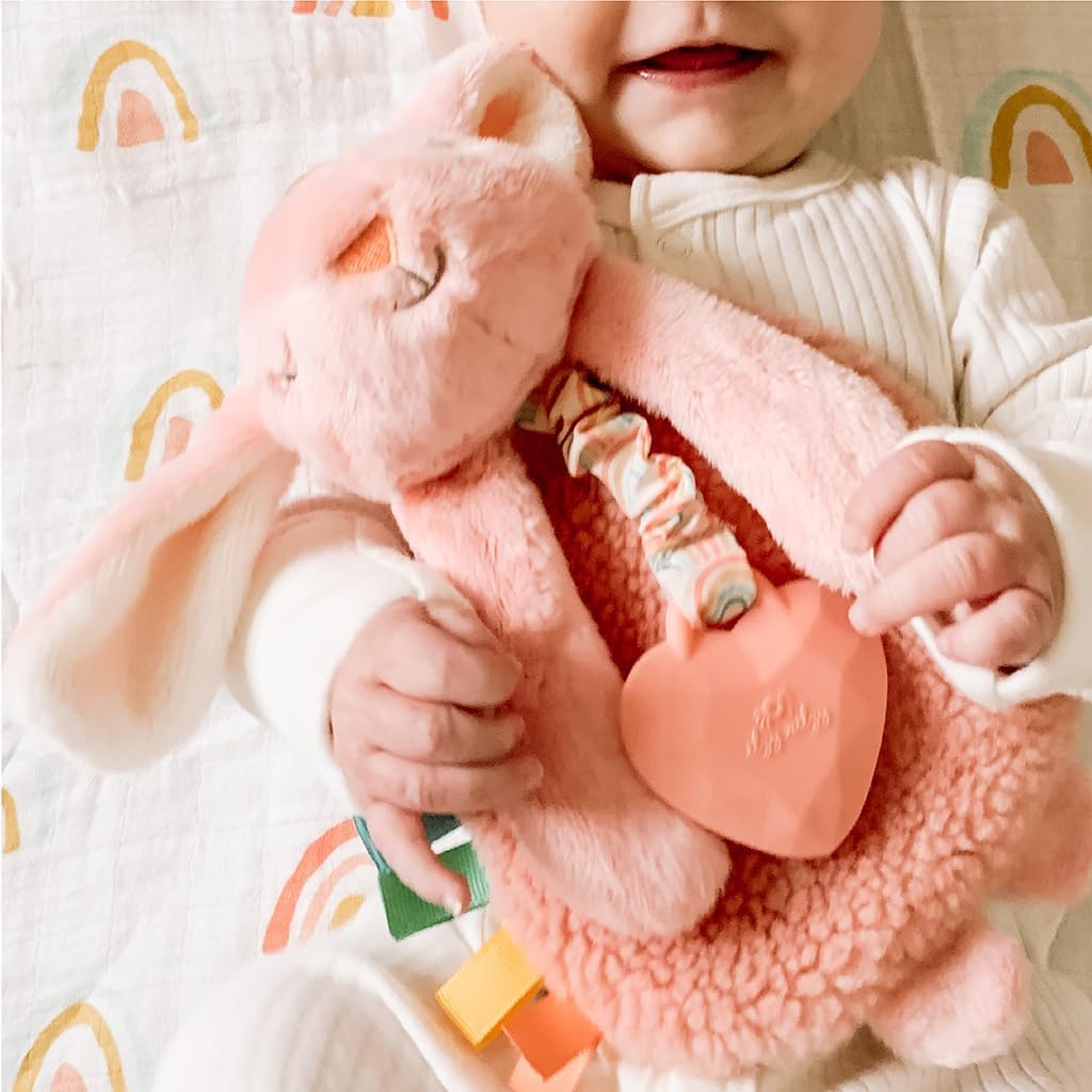 Itzy Ritzy - Itzy Lovey Including Teether - Baby Lovey with Teether, Textured Ribbons & Dangle Arms - Features Crinkle Sound, Sherpa Fabric and Minky Plush (Pink Bunny)